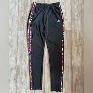 Adidas women’s black track pants with multicolor stripes